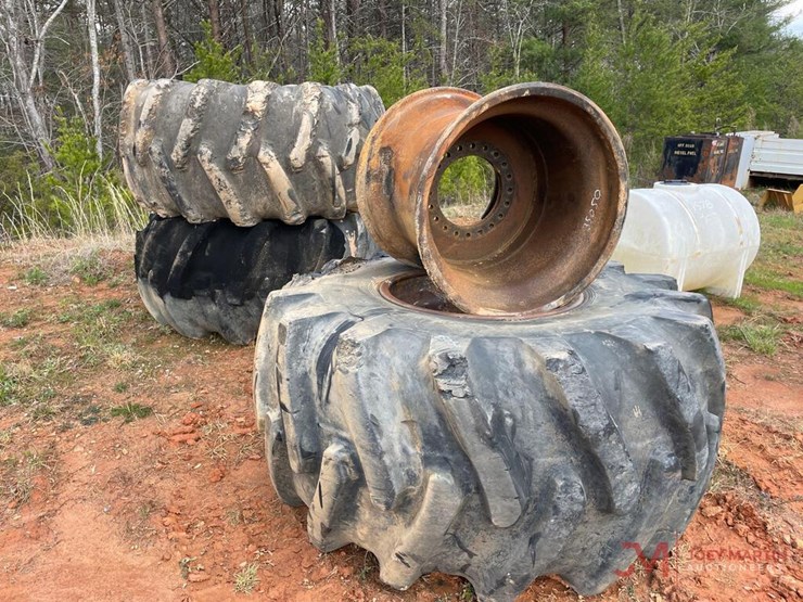 (3) SKIDDER TIRES, (4) SKIDDER RIMS Lot 3840, HIGH COUNTRY HEAVY