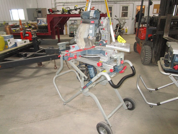 12" BOSH SLIDIING COMPOUND MITER SAW ON BOSH TABLE Lot 521, ST