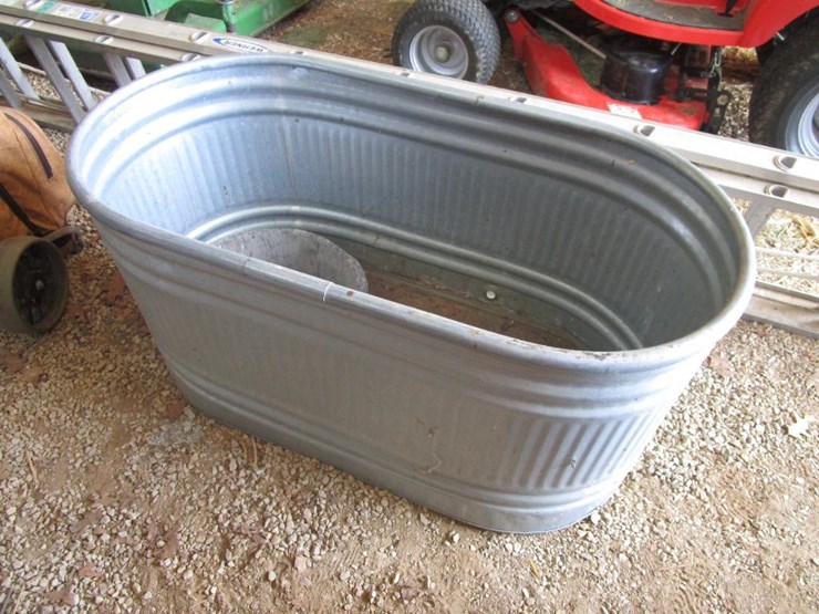 2638 • 100 Gallon Galvanized Stock Tank Lot 2638, New Holland TC30