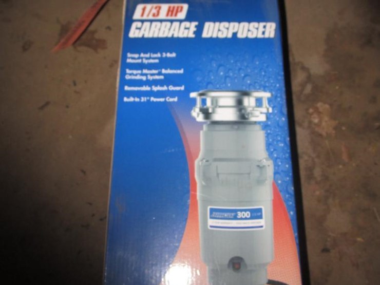 2610 • Barracuda 1/3HP Garbage Disposal Lot 2610, New Holland TC30