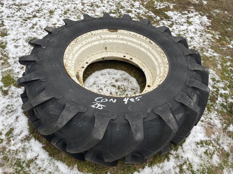 New Michelin 18.4x34 tire on rim Lot 86, Voelker Bros Annual Winter